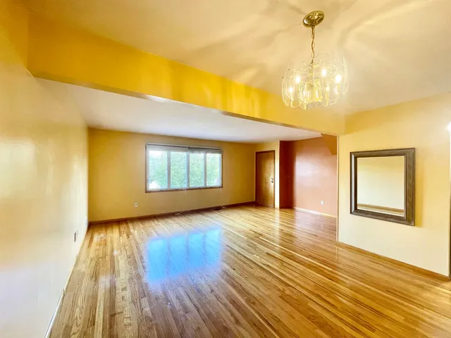 a kitchen with a stove a refrigerator and a sink