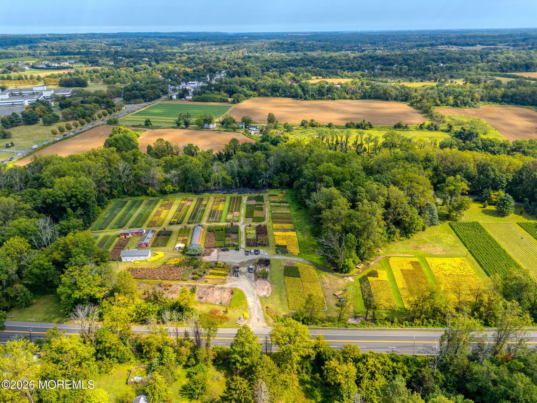 1158 Highway 34 Colts Neck, NJ 07722 - Photo 10 of 14 an aerial view of residential houses with outdoor space and swimming pool