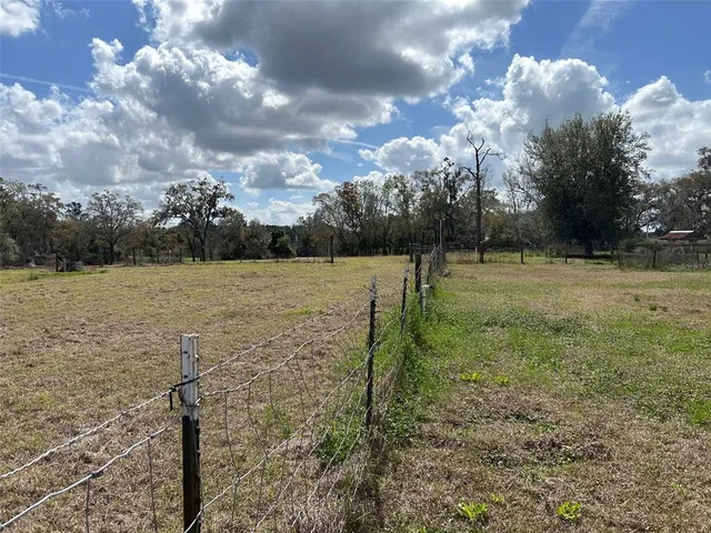 a view of a lake with a yard