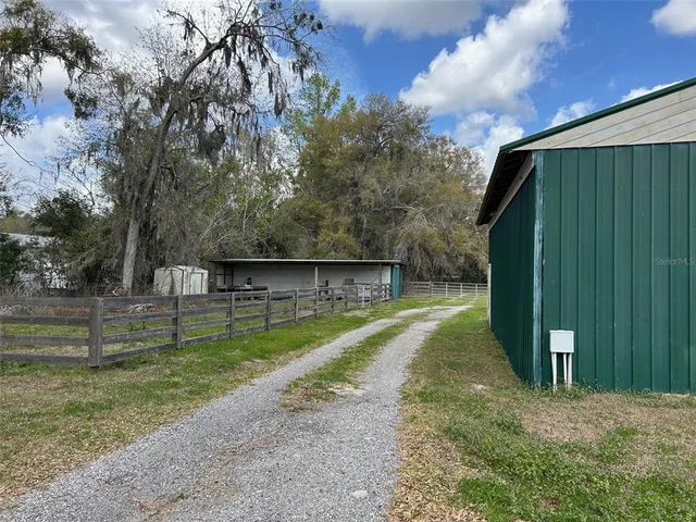 a view of backyard with green space