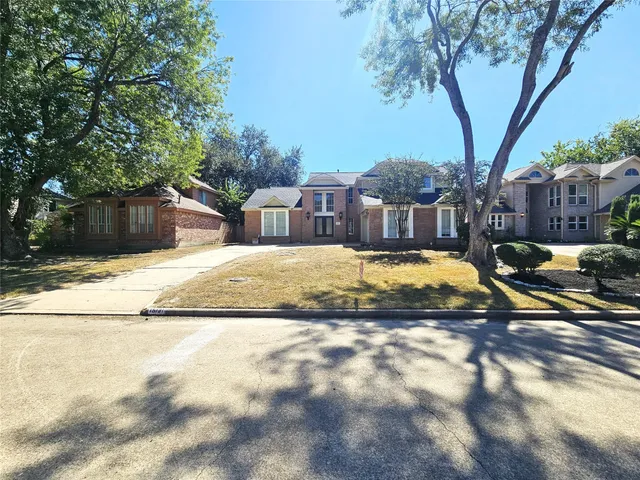 a view of a house with swimming pool