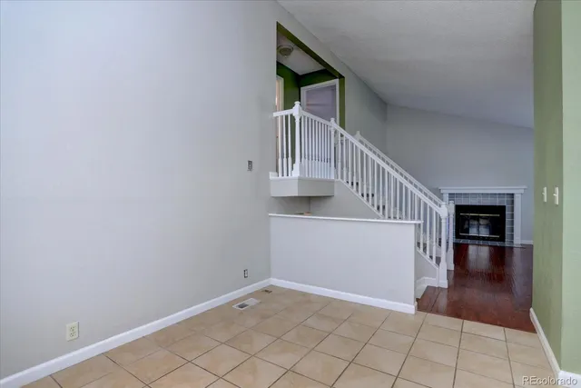 a kitchen with cabinets and steel appliances