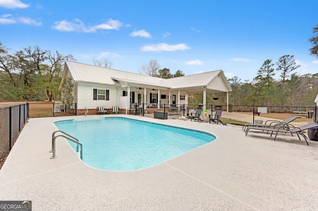 a view of a chairs and table in a patio