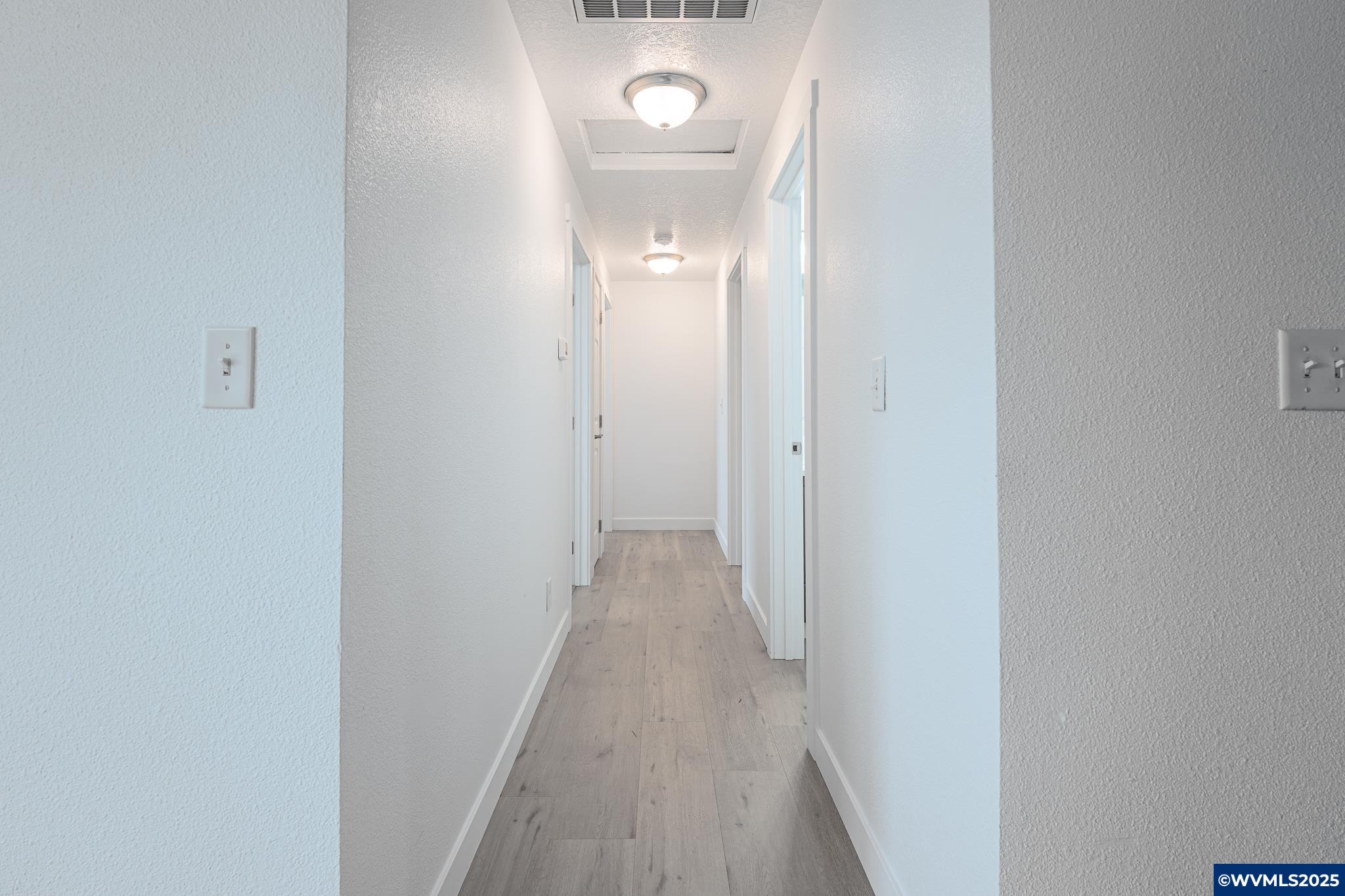 1467 South 7th Street Independence, OR 97351 - Photo 27 of 31 a view of a hallway with wooden floor