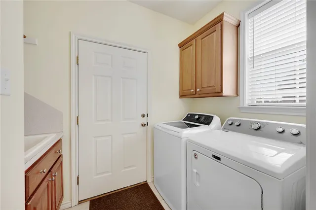 a utility room with dryer and washer