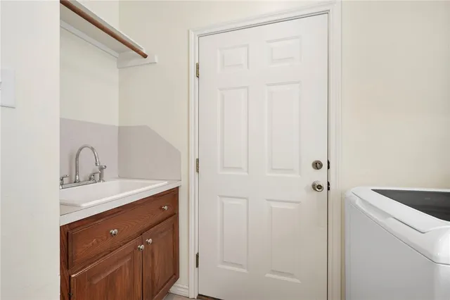 a bathroom with a sink and mirror