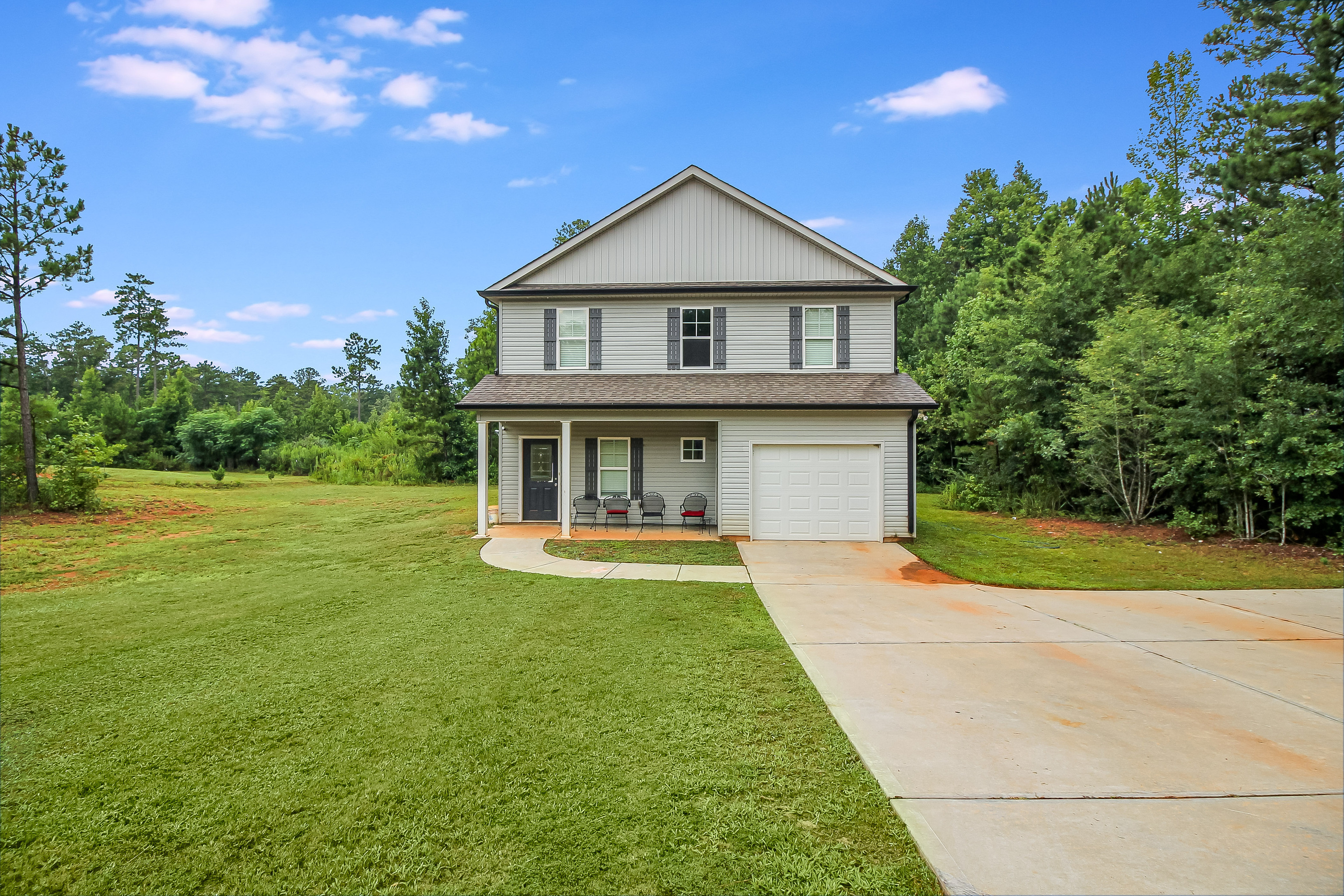 a front view of a house with garden