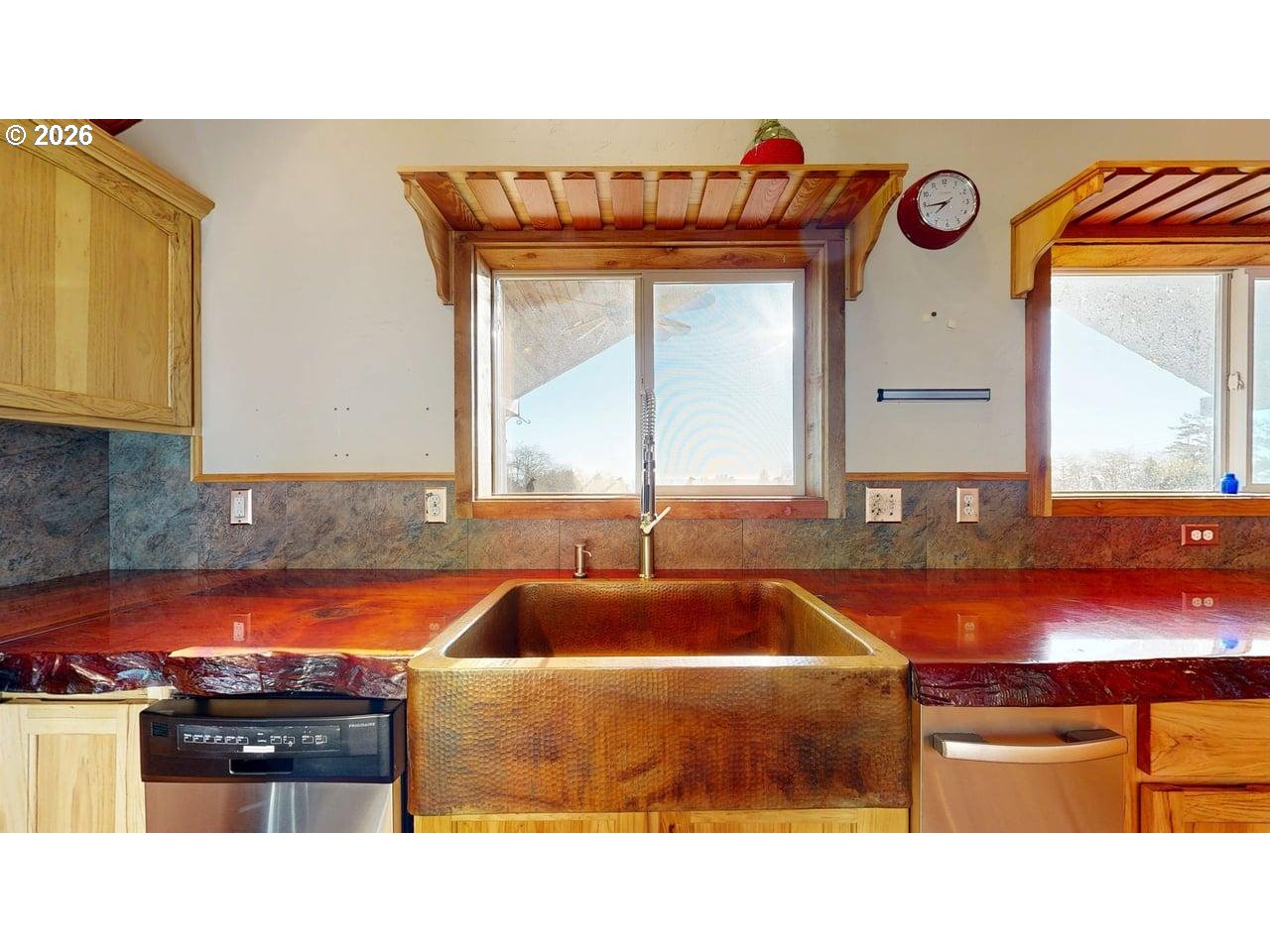 99106 East Freeman Lane Brookings, OR 97415 - Photo 13 of 37 a kitchen with a stove a sink and a cabinets