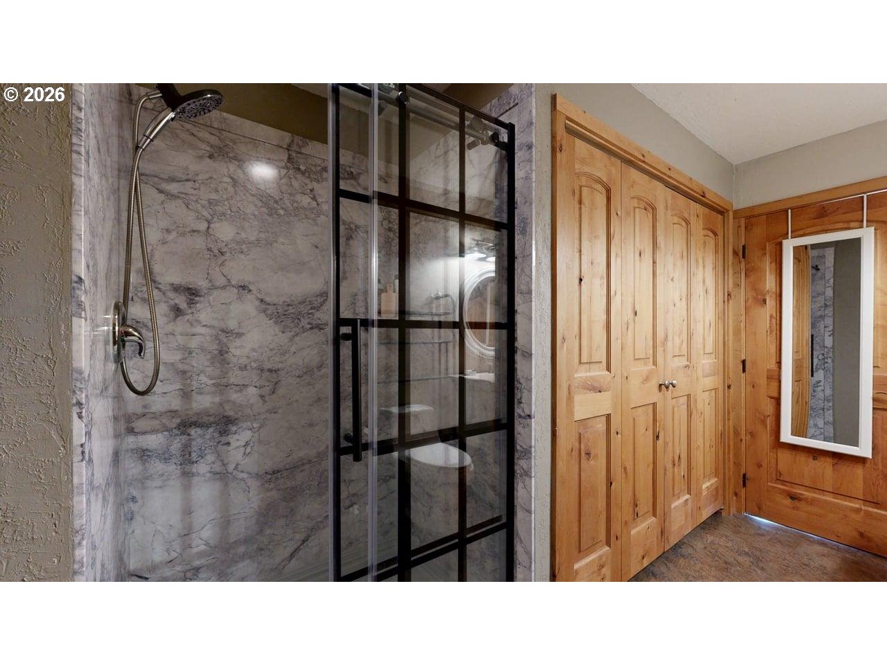 99106 East Freeman Lane Brookings, OR 97415 - Photo 22 of 37 a black and white photo of a bathroom