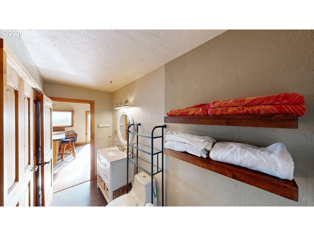 99106 East Freeman Lane Brookings, OR 97415 - Photo 23 of 37 a living room with furniture and a flat screen tv