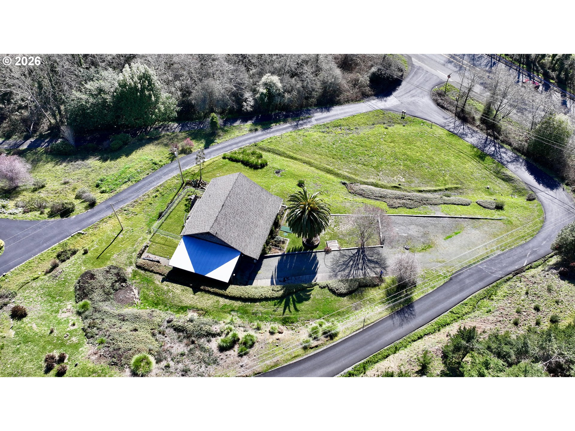 99106 East Freeman Lane Brookings, OR 97415 - Photo 31 of 37 a view of a swimming pool with a yard