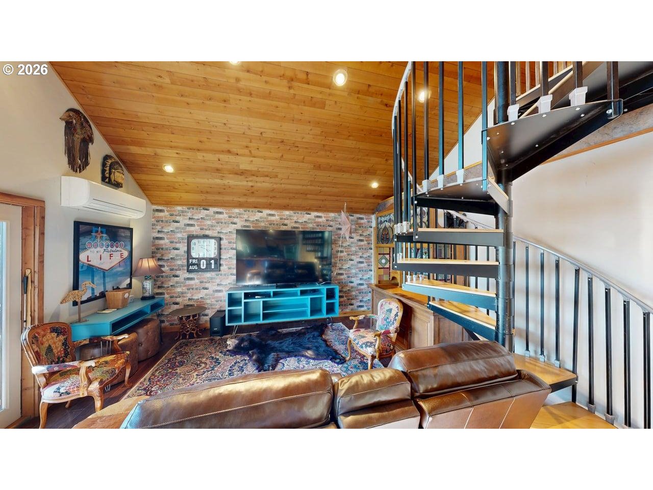 99106 East Freeman Lane Brookings, OR 97415 - Photo 8 of 37 a living room with furniture a flat screen tv and a table