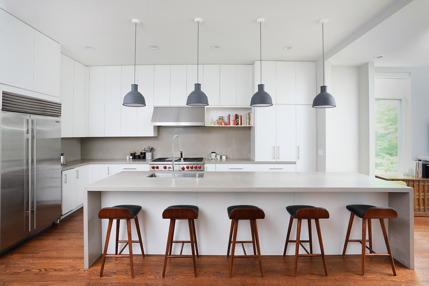 1821 West Cortland Street Chicago, IL 60622 - Photo 18 of 50 a kitchen with stainless steel appliances a table chairs in it and wooden floors