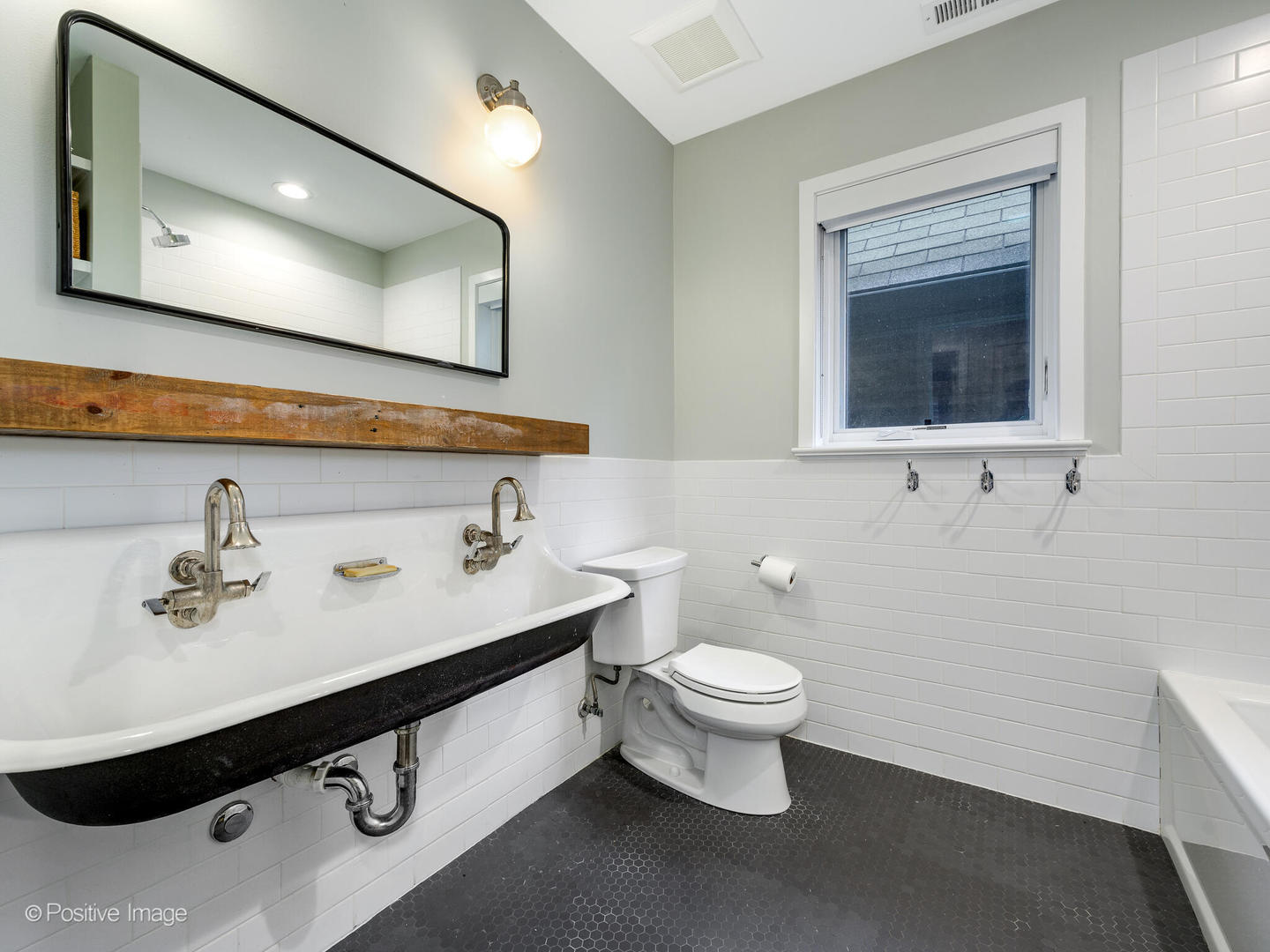 1821 West Cortland Street Chicago, IL 60622 - Photo 24 of 50 a bathroom with a sink mirror and toilet