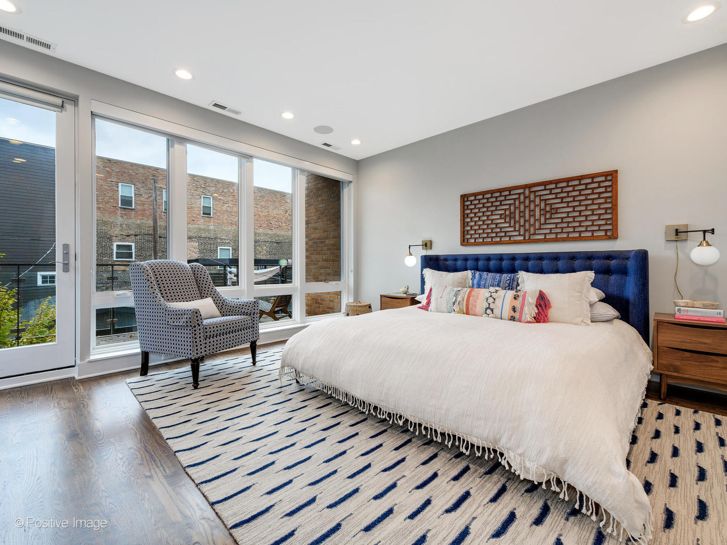 1821 West Cortland Street Chicago, IL 60622 - Photo 25 of 50 a bedroom with a bed and glass door