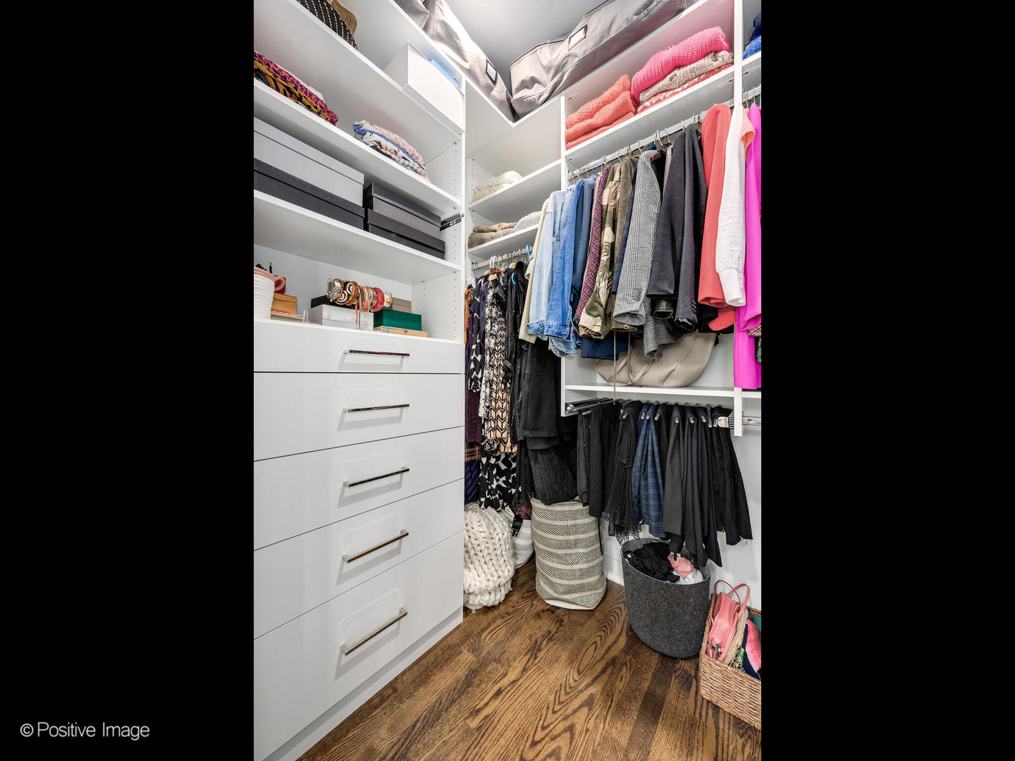 1821 West Cortland Street Chicago, IL 60622 - Photo 27 of 50 a view of walk in closet with clothes and shoes