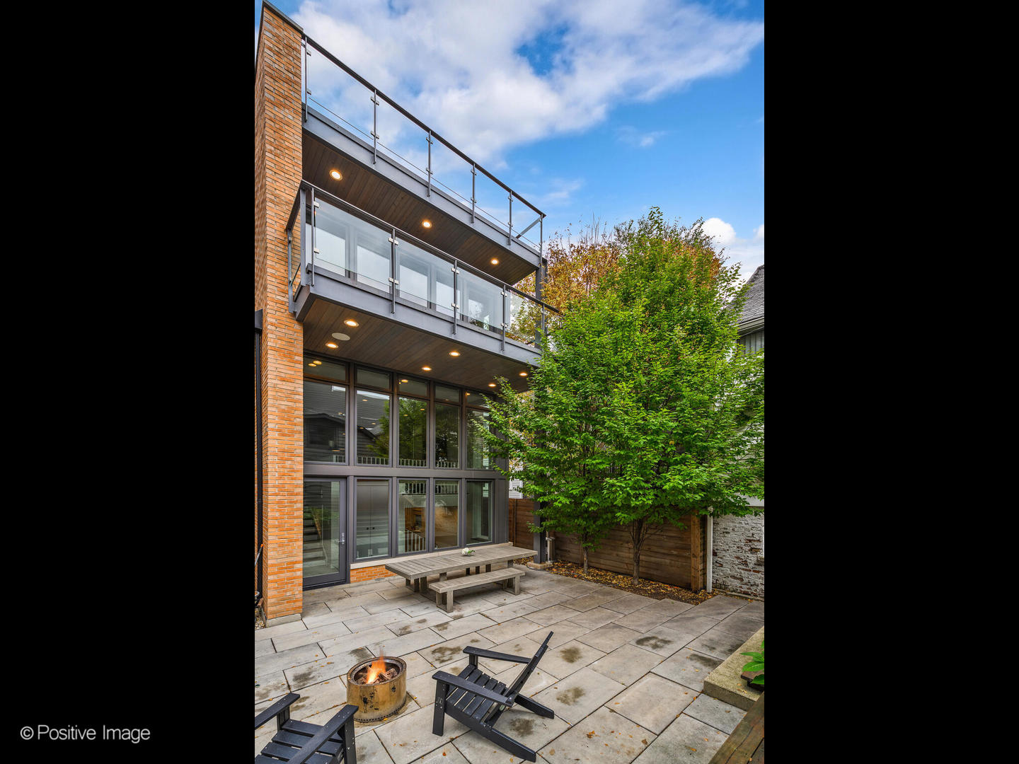 1821 West Cortland Street Chicago, IL 60622 - Photo 41 of 50 a backyard of a house with table and chairs