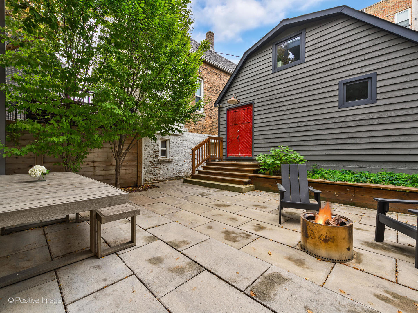 1821 West Cortland Street Chicago, IL 60622 - Photo 44 of 50 a backyard of a house with barbeque oven table and chairs