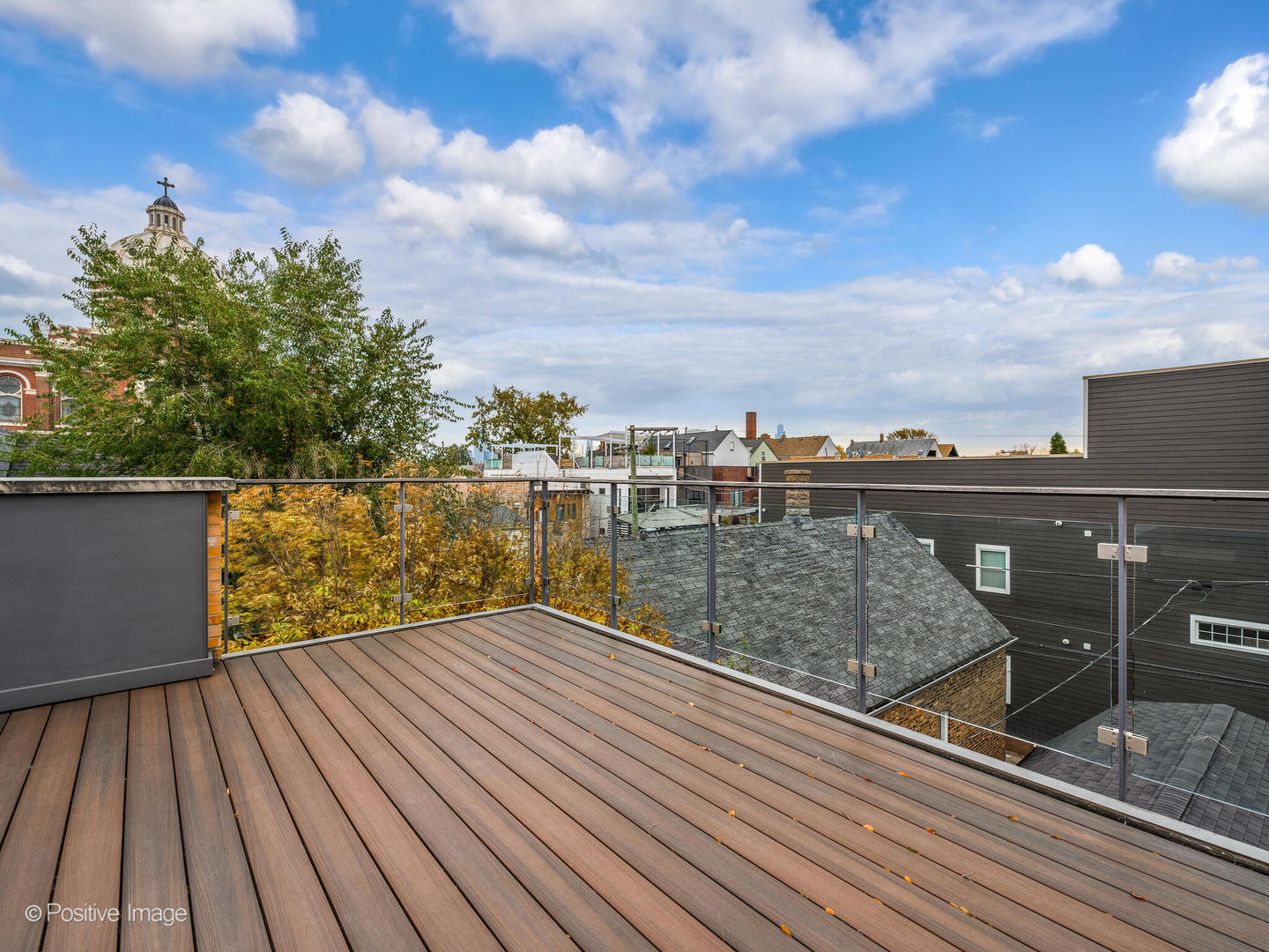 1821 West Cortland Street Chicago, IL 60622 - Photo 46 of 50 a view of balcony with wooden floor and fence