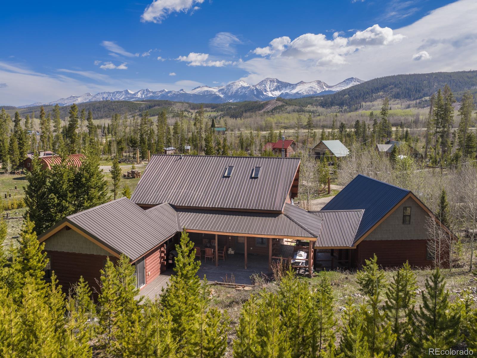 341 Anderson Road Walden, CO 80480 - Photo 2 of 50 an aerial view of a house with a garden and lake view