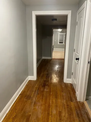 a view of gallery with wooden floor