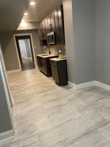 a view of kitchen with wooden floor