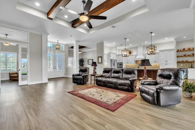 a view of kitchen with stainless steel appliances granite countertop a refrigerator and a stove