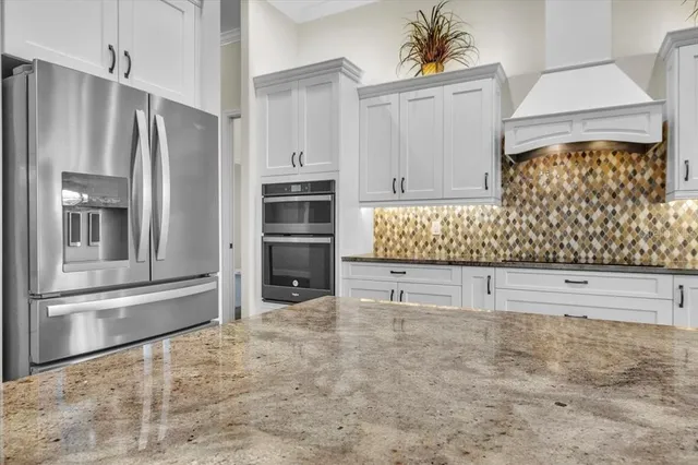 a en suite bathroom with a toilet sink and mirror
