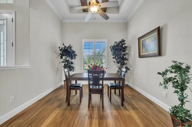 a view of a livingroom with furniture and a ceiling fan