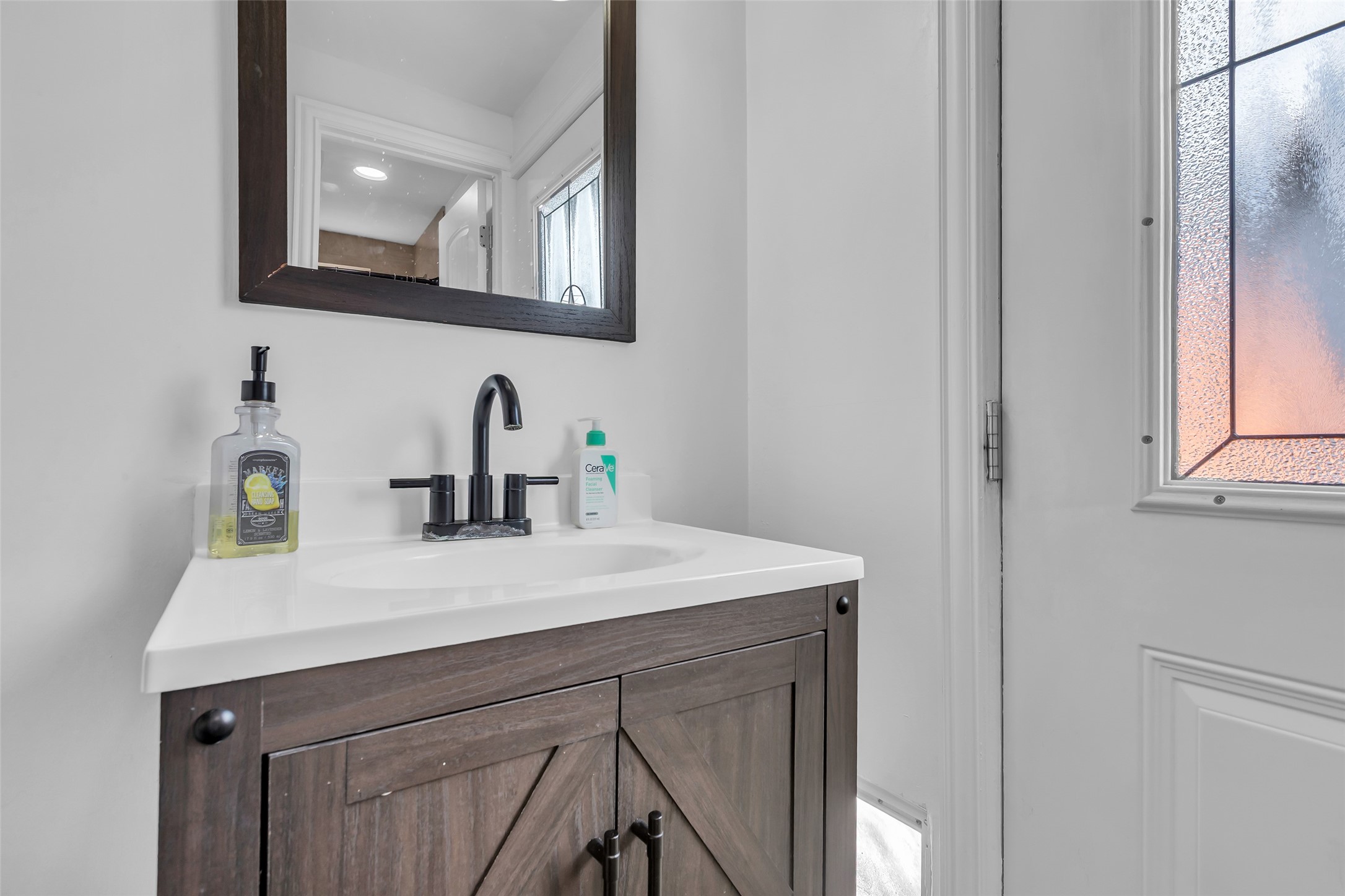 618 Harvard Street Houston, TX 77007 - Photo 14 of 25 a bathroom with a sink vanity and a mirror