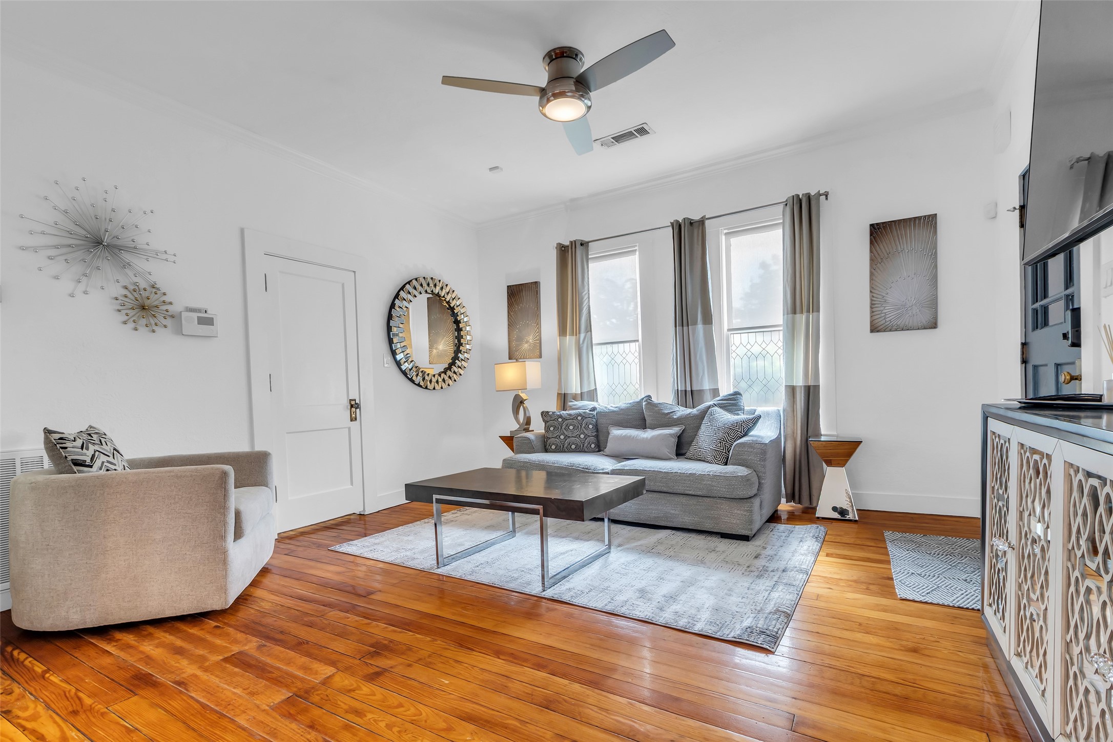 618 Harvard Street Houston, TX 77007 - Photo 4 of 25 a living room with furniture and a wooden floor