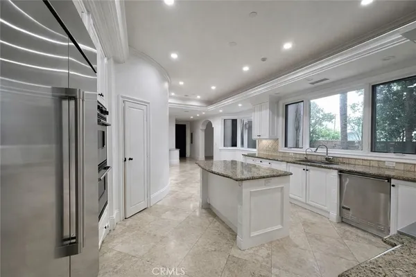 a large bathroom with a large tub and sink
