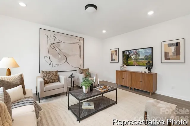 a living room with furniture and a flat screen tv