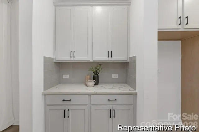 a view of cabinets and wooden floor