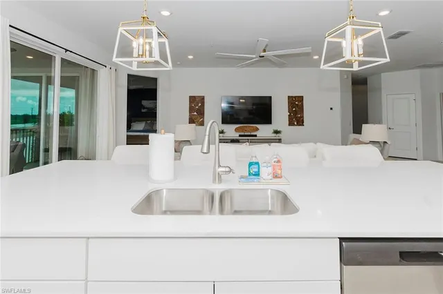 a close view of kitchen sink and microwave