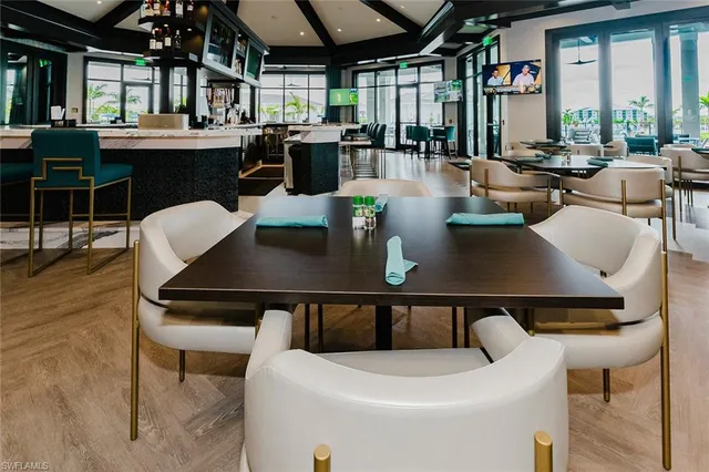 a view of kitchen with dining table and chairs