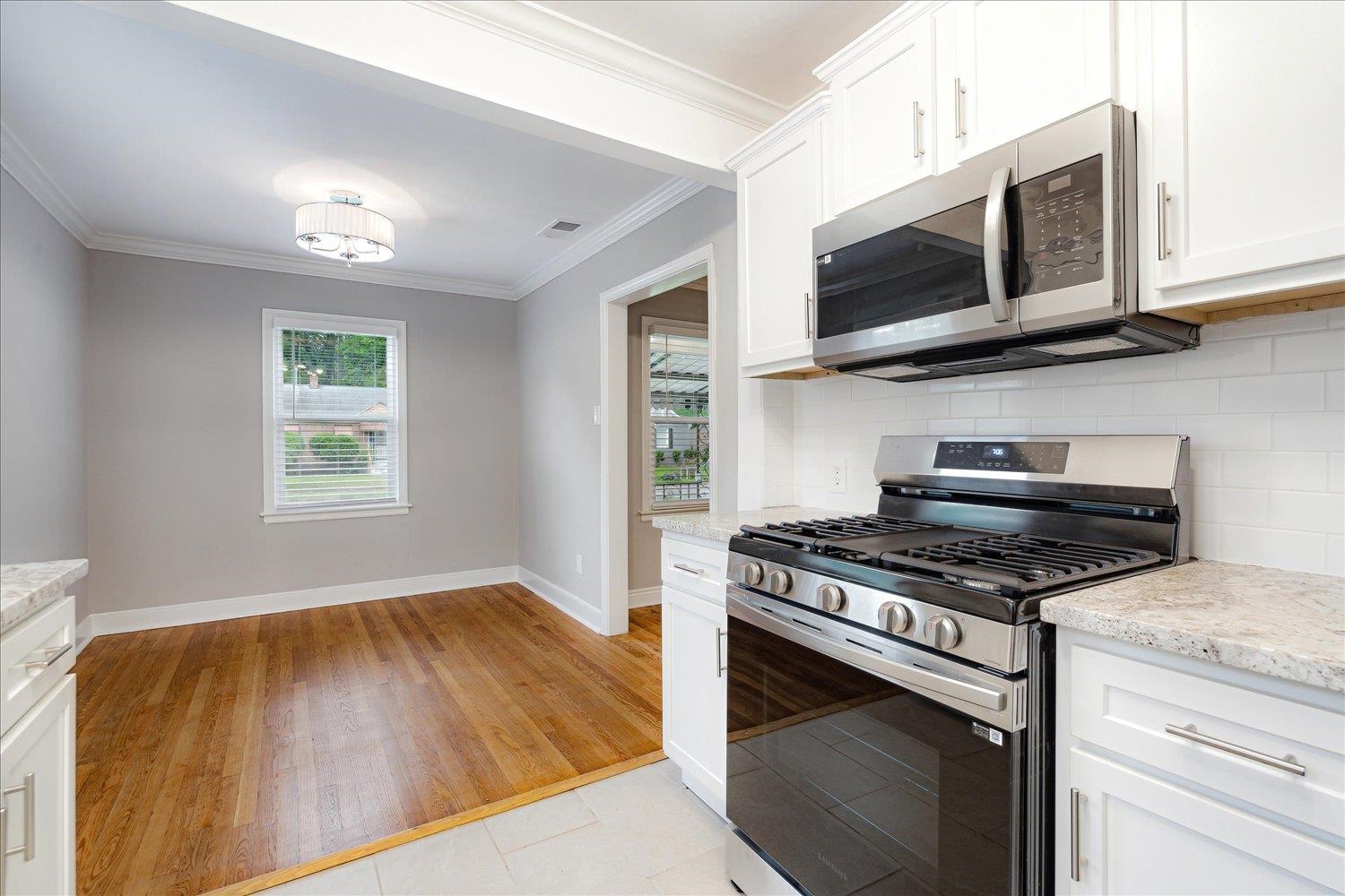 774 Eastern Drive Memphis, TN 38122 - Photo 13 of 33 a kitchen with a stove and a microwave
