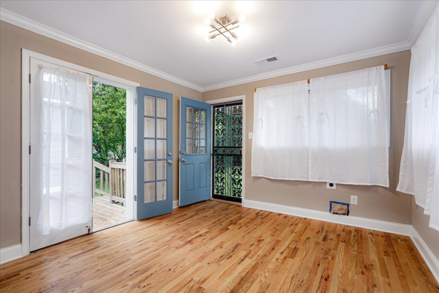 774 Eastern Drive Memphis, TN 38122 - Photo 18 of 33 a view of an empty room with wooden floor and a window