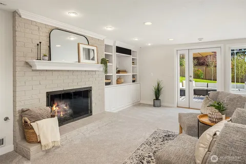 a living room with furniture fireplace and a flat screen tv