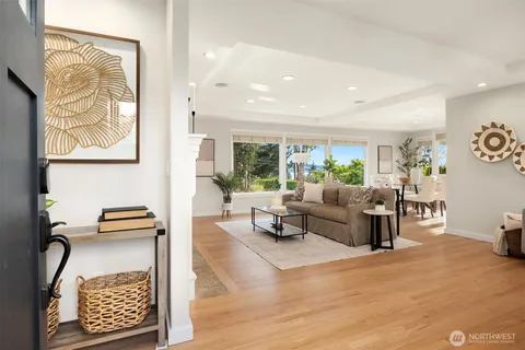 a dining room with furniture wooden floor and a rug