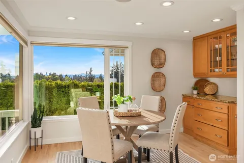 a kitchen with stainless steel appliances granite countertop a refrigerator stove and sink