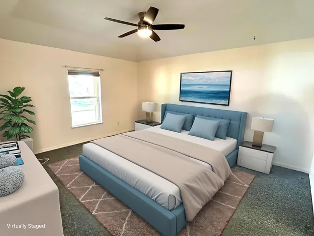 a bedroom with bed and window