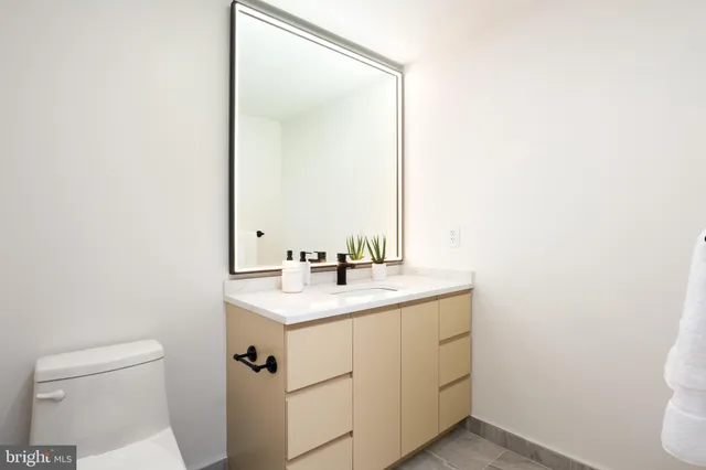 a view of living room filled with furniture and wooden floor