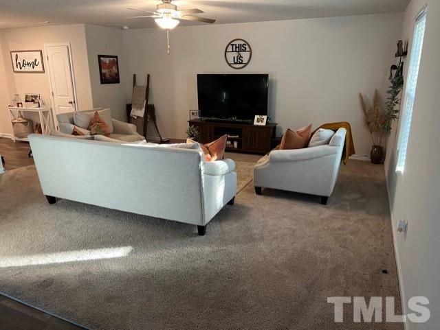 324 Rustling Way Zebulon, NC 27597 - Photo 2 of 3 a living room with furniture and a flat screen tv
