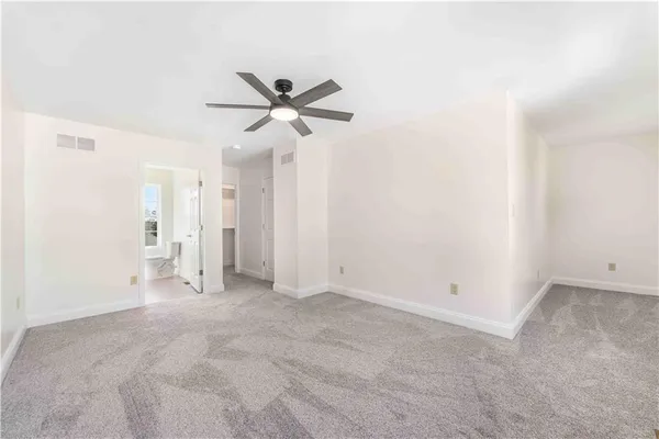 a view of empty room with closet