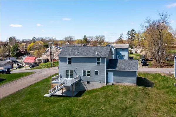 a view of a house with a yard porch and sitting area