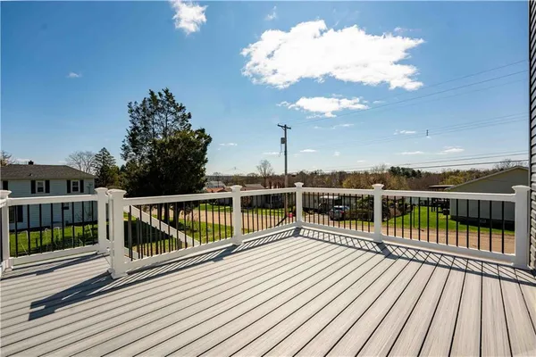 a view of balcony with wooden floor