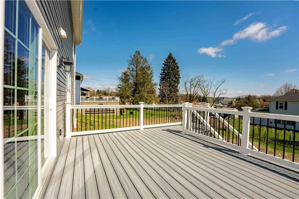 a view of a balcony with two chairs