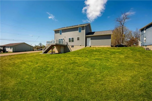 a view of a house with backyard
