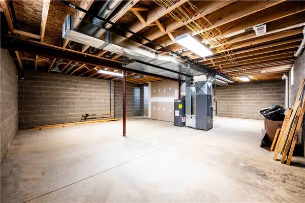 a view of empty room with wooden walls